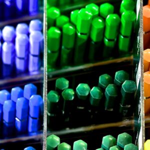 Colorful array of pencils in a store display, showcasing vibrant shades.